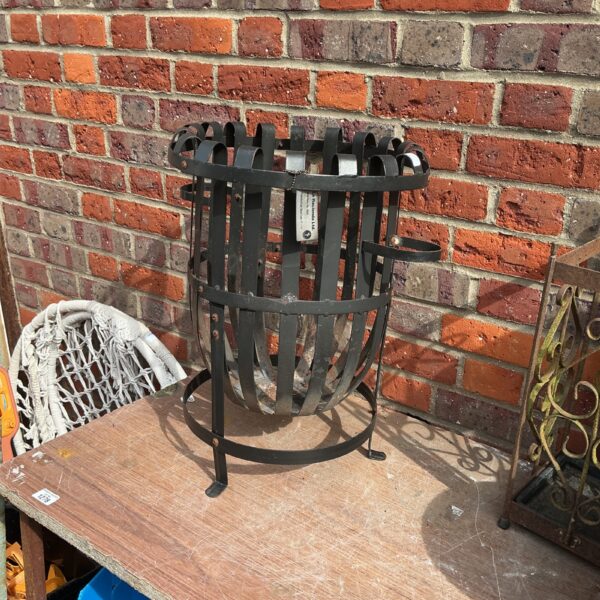 Vintage metal fire basket for logs and fireplace decor.