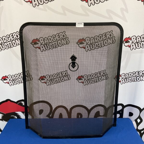 Vintage metal firescreen for fireplace safety and home decor.
