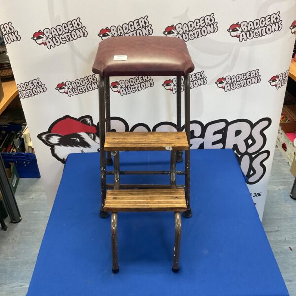 Vintage metal folding step stool for workshop or farm use.
