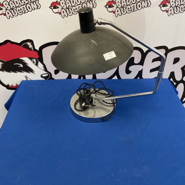 Vintage metal task lamp with adjustable arm and conical shade.