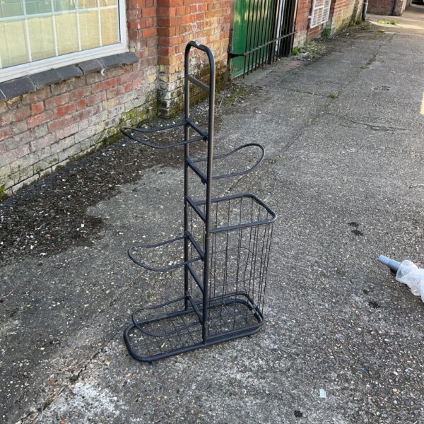 Vintage metal tool stand for workshop storage and organization.