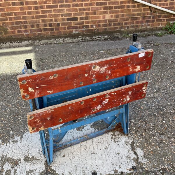 Vintage metal workbench, ideal for DIY projects and workshop tasks.