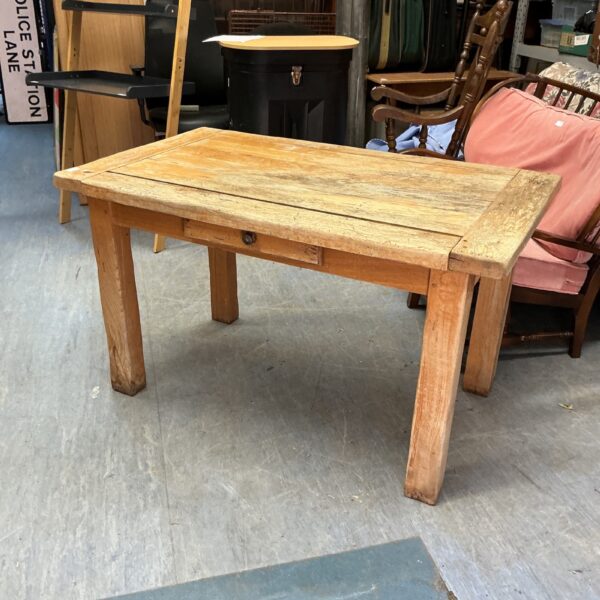 Vintage oak kitchen table with rustic charm and farmhouse style.