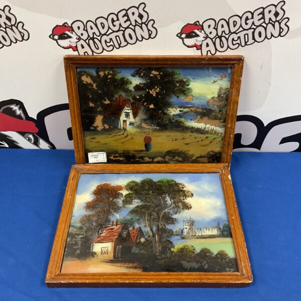 Pair of vintage oil paintings on glass depicting a rural landscape.