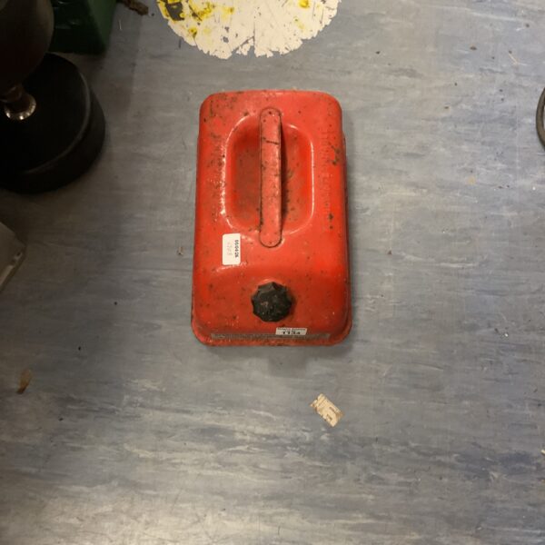 Red vintage outboard fuel tank for boat motors.