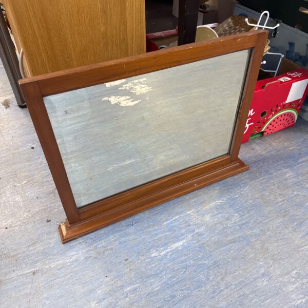 Vintage overmantle mirror with wooden frame, ideal for fireplace mantels.