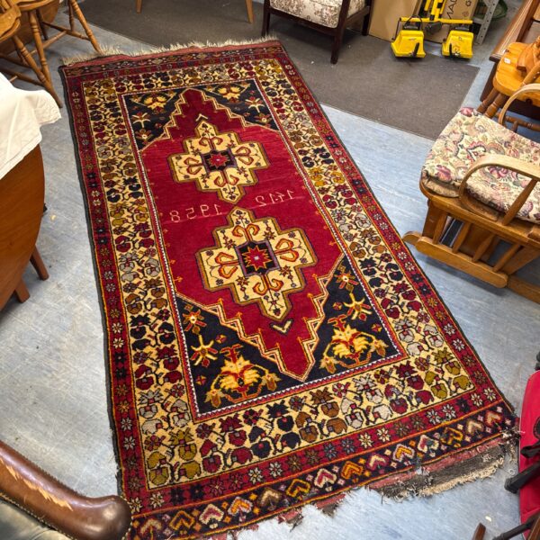 Large vintage Persian rug with traditional Anatolian design.