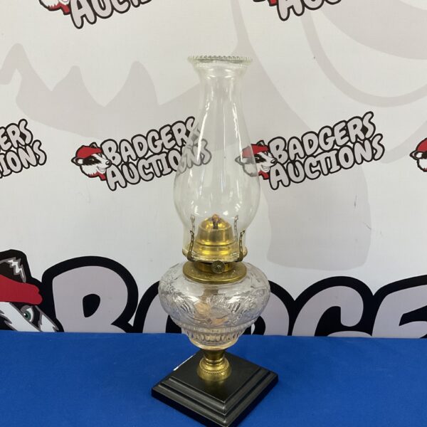 Vintage PGA MFG Co paraffin lamp with clear glass reservoir.