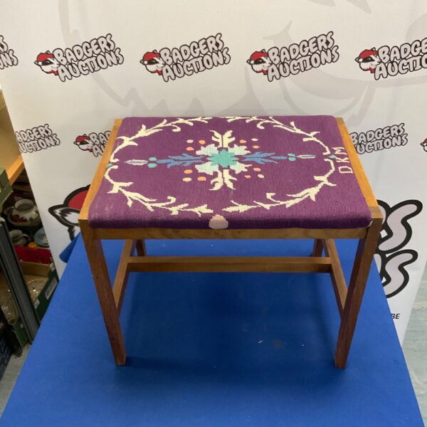 Vintage piano stool with colourful tapestry upholstery.