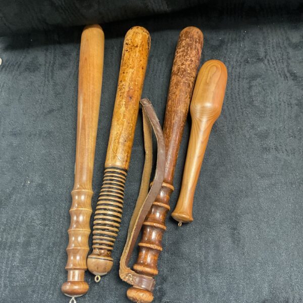 Lot of four vintage wooden police truncheons for collectors.