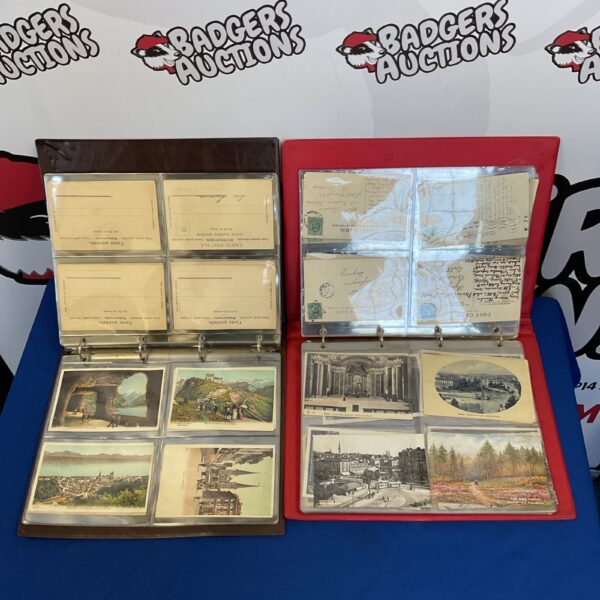Vintage postcard album with visible postcards inside.