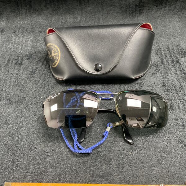 Vintage Ray-Ban sunglasses with original case, classic retro eyewear.