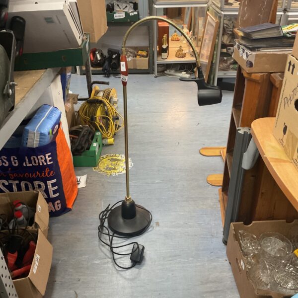 Vintage reader floor lamp with adjustable arm and black base.