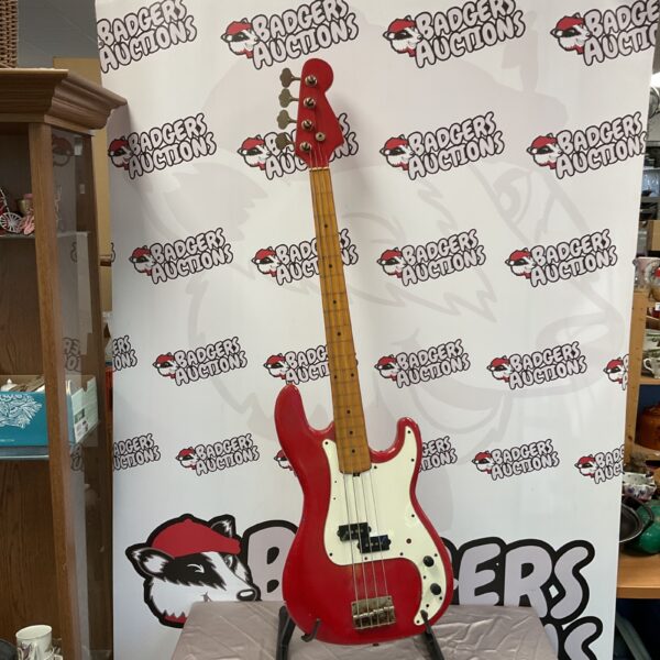 Vintage red bass guitar, classic electric instrument.