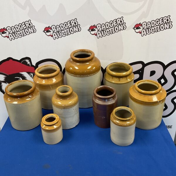 Collection of vintage salt glazed stoneware jars for collectors.