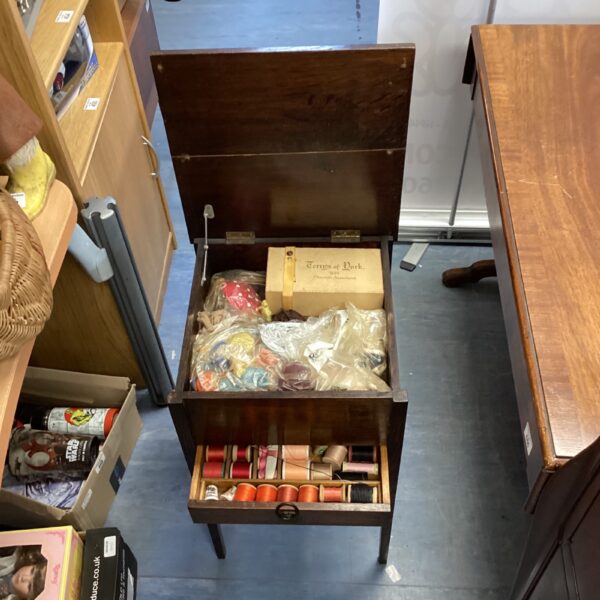 Vintage mahogany sewing table with contents, antique sewing workstation.