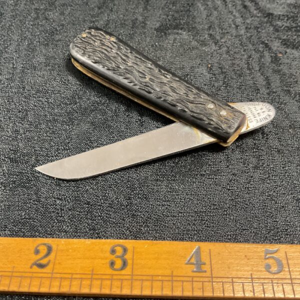 Closed vintage Sheldon pocket knife with bone handle.