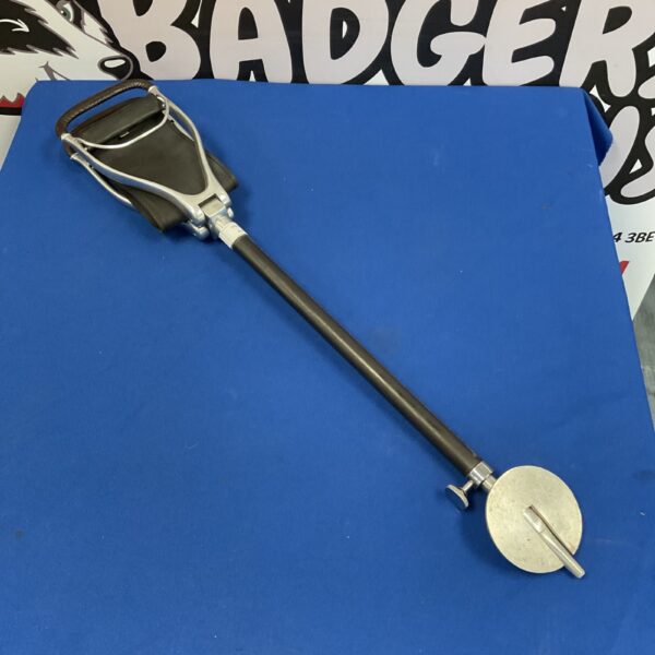 Vintage shooting stick with black leather seat for game shooting.
