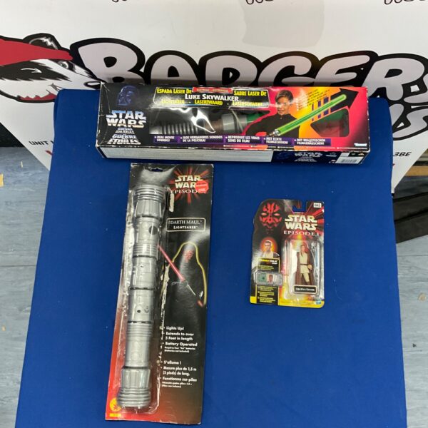Vintage Star Wars Luke Skywalker lightsaber with figures.