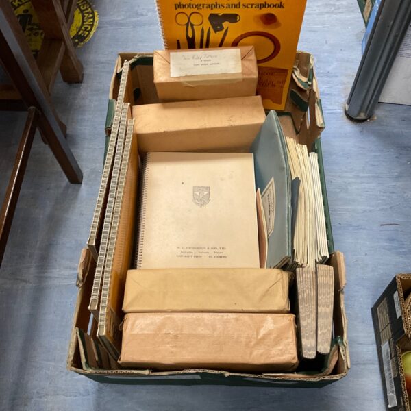 Vintage stationery lot with notepads, jotters, and scrapbooks.