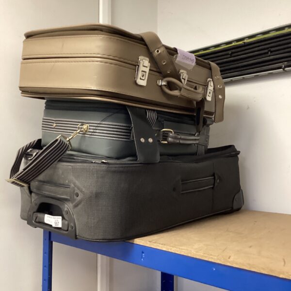Vintage suitcases lot with wheeled travel case.