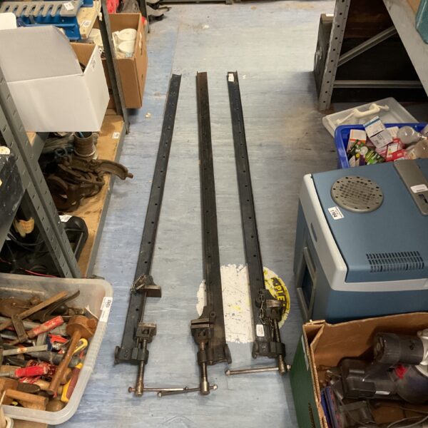 Vintage lot of three metal T-bar clamps for woodworking.