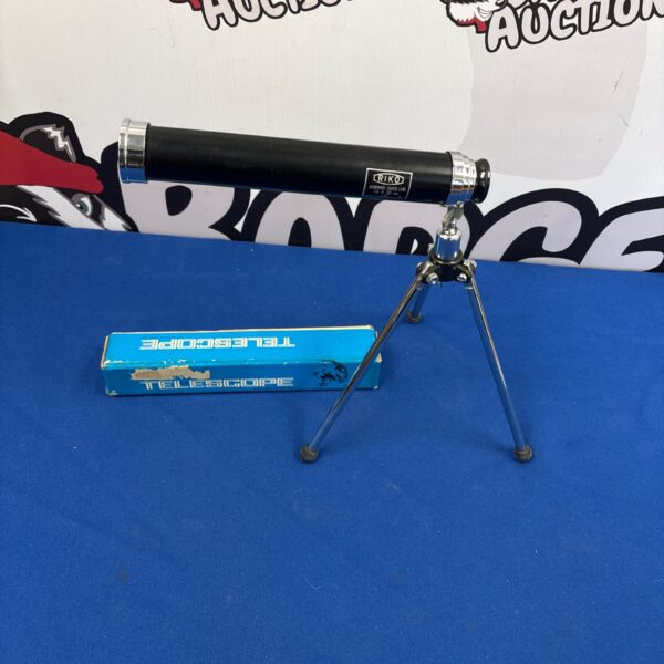 Vintage telescope in its original box with stand.