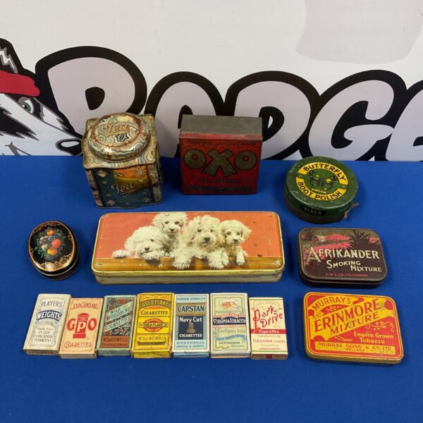 Collection of vintage tobacco tins, including Capstan and Gold Flake.