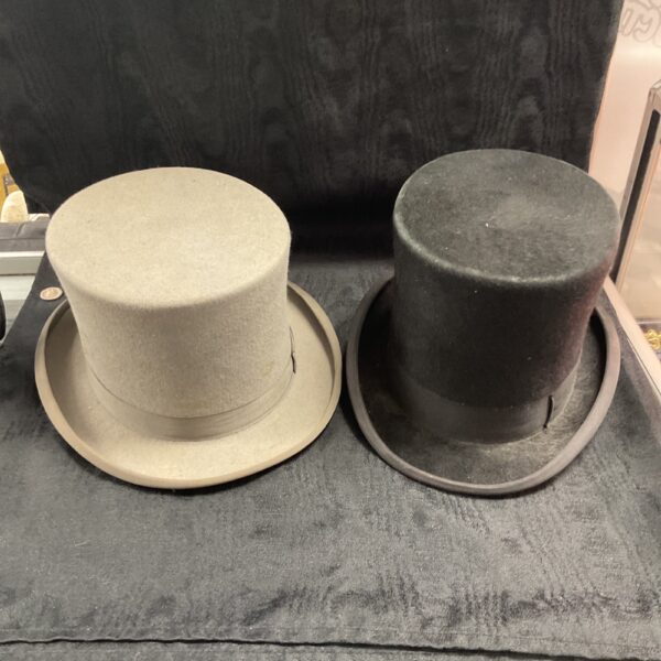 Pair of vintage black top hats by Christies London and Dormie.