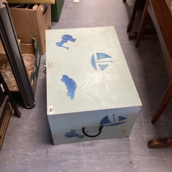Vintage painted toy box with sailing boat and train designs.