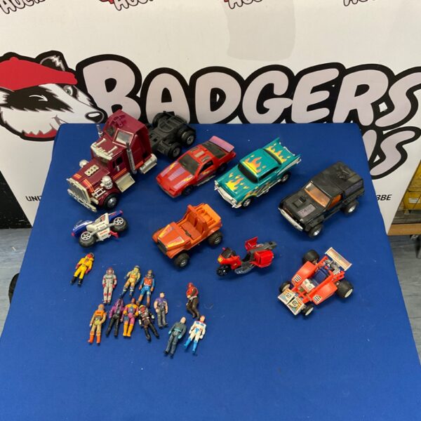 Vintage toy cars and truck lot with figures, collectible diecast vehicles.