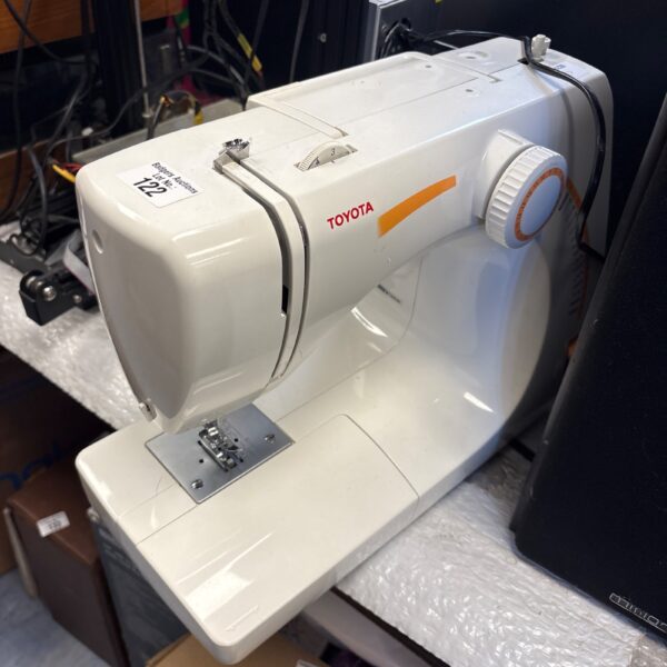 Vintage Toyota sewing machine, a retro collectible for crafting enthusiasts.