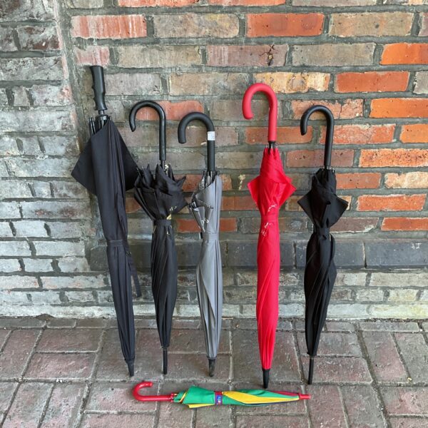 Group of six vintage umbrellas in various colours.