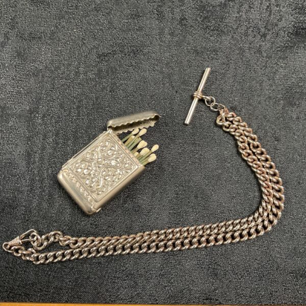 Antique silver plated vesta case with vestas and watch fob chain.
