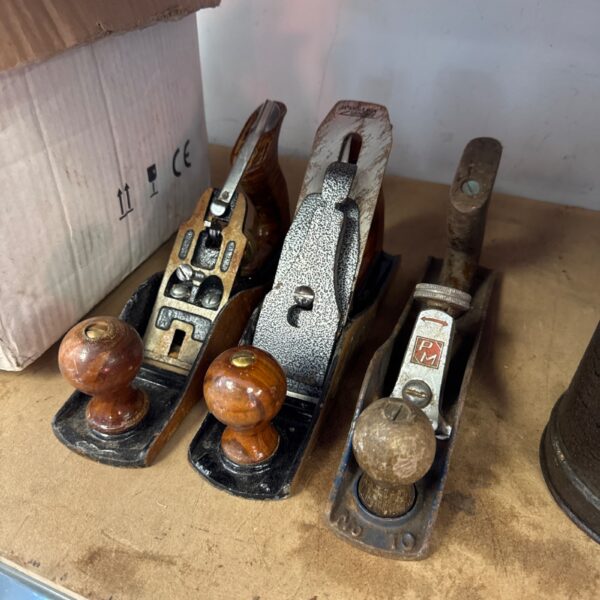 Lot of three vintage wood planes, including a PM plane.