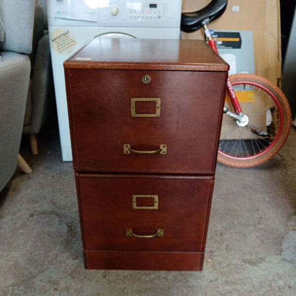 Vintage wooden filing cabinet with two drawers, retro office storage.