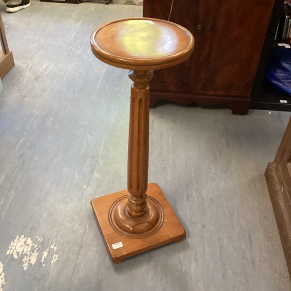 Vintage wooden jardinere plant stand with fluted pedestal base.