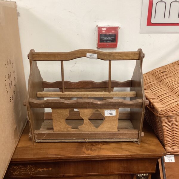 Vintage wooden magazine rack with playing card design.