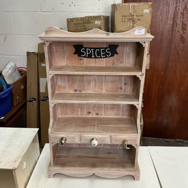 Vintage wooden spice rack for kitchen storage and display.