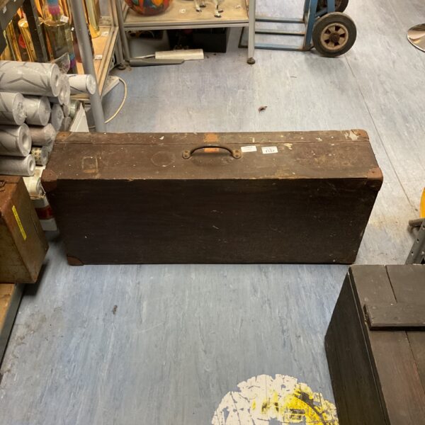 Vintage wooden tool chest with carrying handle, antique storage solution.