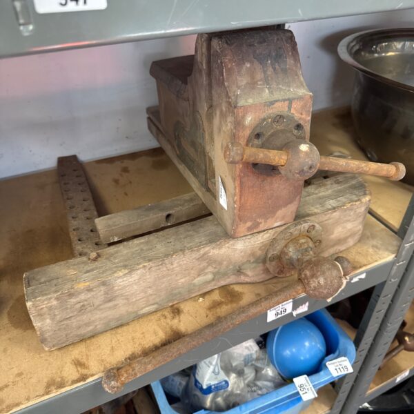 Vintage woodworkers bench clamps, antique woodworking tools on display.