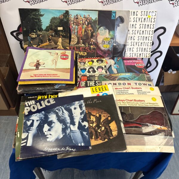 Vintage vinyl record collection including Beatles, Rolling Stones, and The Police.