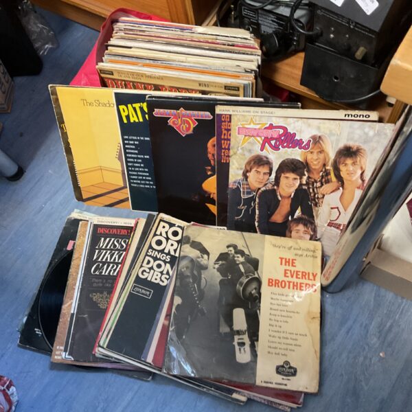 Vintage vinyl record collection featuring Bay City Rollers and The Shadows.