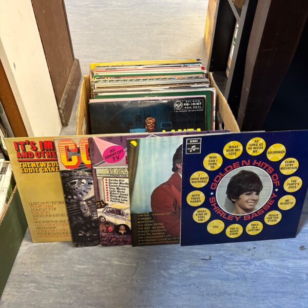Vintage vinyl record collection including Jim Reeves records.