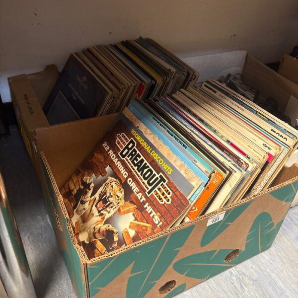 Mixed vinyl record lot in cardboard boxes.