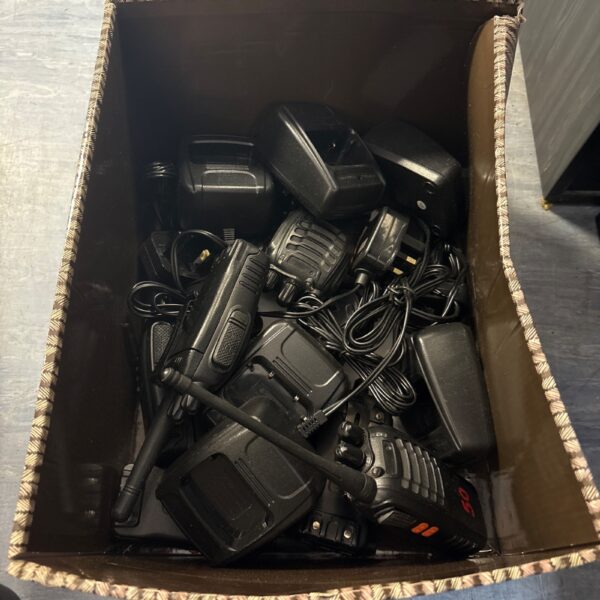 Walkie talkie set with chargers, vintage communication devices.