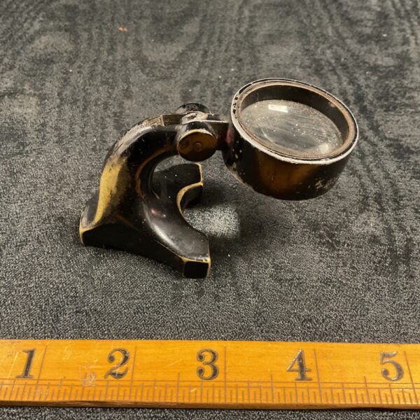 Vintage brass wartime magnifying glass for map reading.