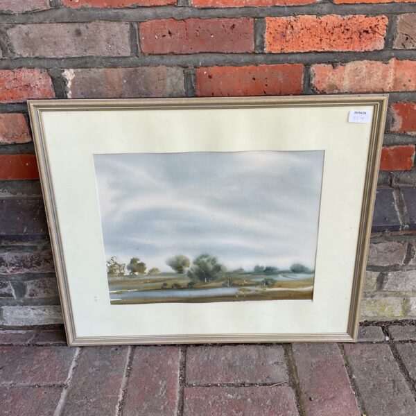 Signed watercolour painting of a peaceful marshland landscape.