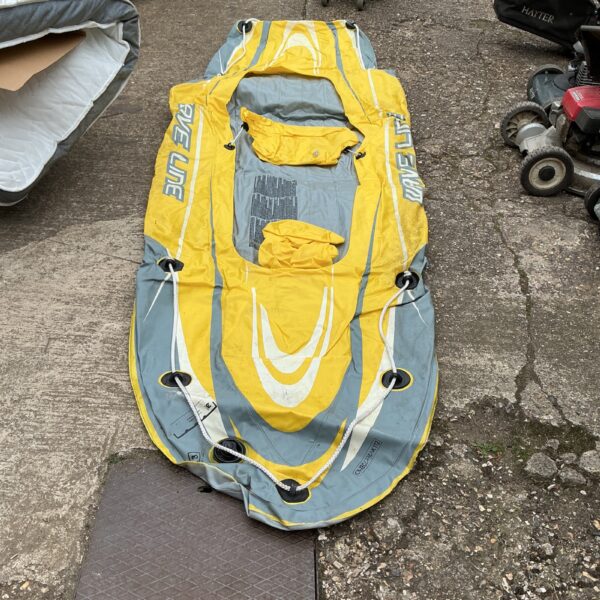 Brightly coloured Wave Line inflatable canoe for two people.