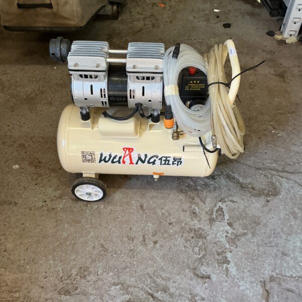 Silver Wayang air compressor with wheels for workshop use.